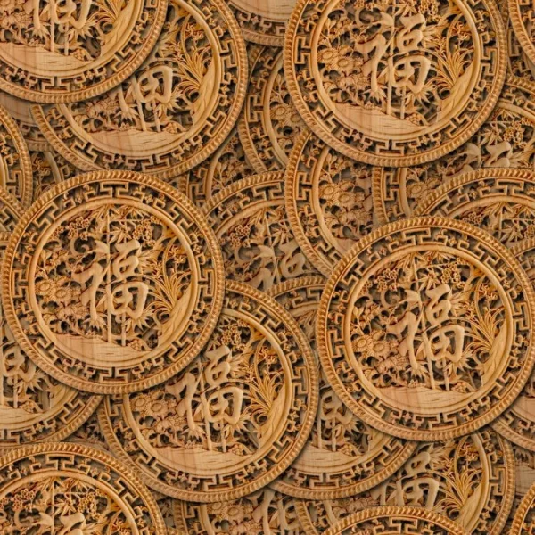 A pattern of intricately carved wooden discs featuring a central character surrounded by floral and geometric designs. The discs are layered with some overlapping, creating a textured appearance. The wood has a warm, golden brown hue.