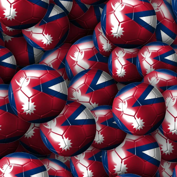 A collection of red and blue soccer balls featuring a white design, including a silhouette of a moose, a V-shaped pattern, and a circular emblem. The balls are piled on top of one another, filling the entire image.