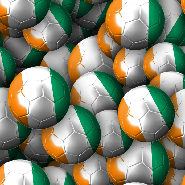 A pile of soccer balls with panels in green, white, and orange, resembling the Irish flag.