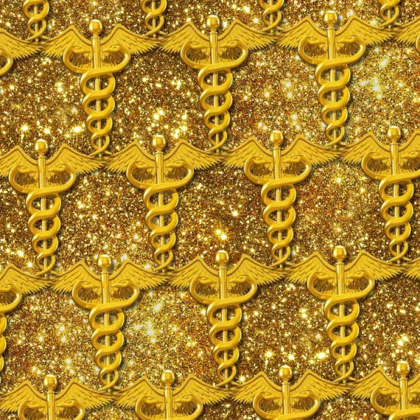 Pattern of gold caduceus symbols on a glittery gold background. The symbols feature intertwined snakes and wings, arranged in a repeating sequence, creating a uniform and ornate design.