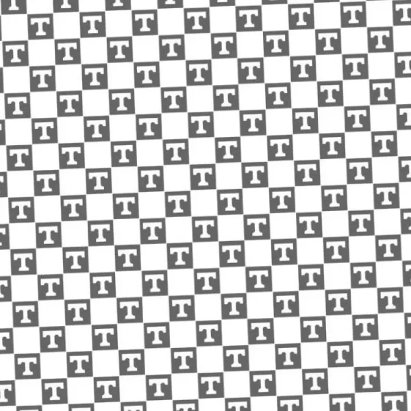 A pattern of closely packed capital letter "T" shapes is displayed in a grid. The letters alternate in orientation, creating a tessellated effect. The overall appearance is monochromatic with a grayscale color scheme.