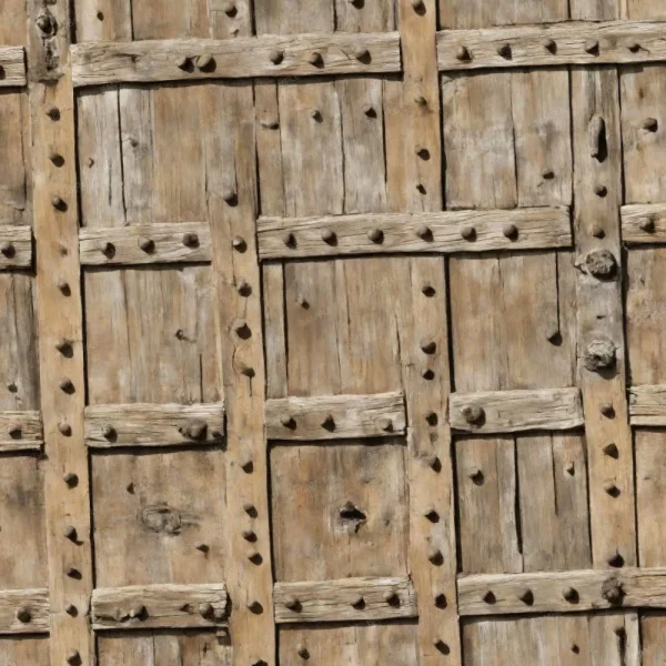 A seamless pattern of A close up of the Old Weathered Church Door 46 (Copy) with rivets on it.