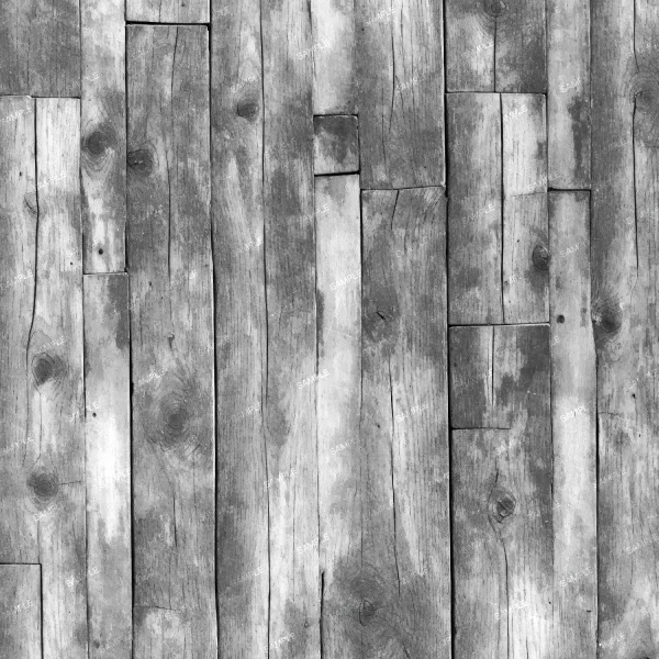 A close-up view of an old wooden plank floor. The planks are unevenly aligned, with visible grain patterns and weathered textures in various shades of grey. Some planks have knots and cracks, adding to the rustic look.