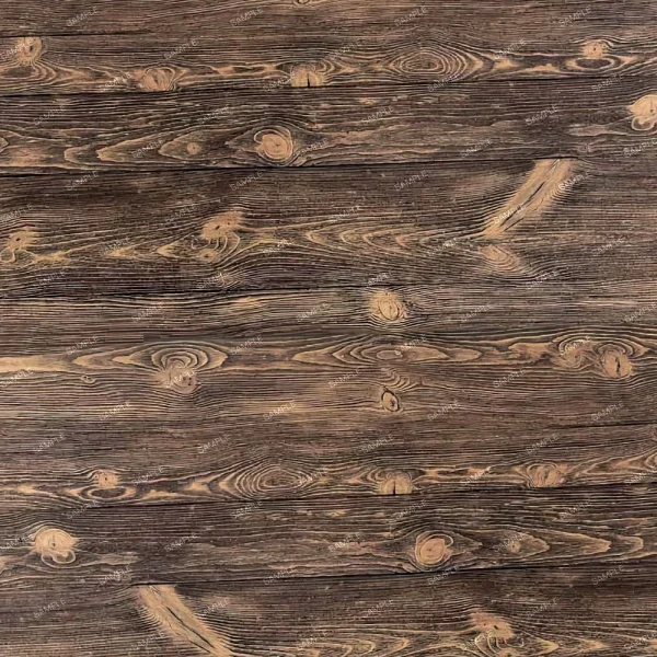 A photo of a wooden surface with a natural, rustic appearance. The wood has visible grain patterns and knot holes, displaying shades of brown and beige. The texture includes linear grooves and swirls typical of aged wooden planks.