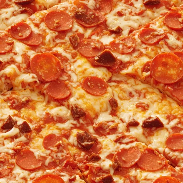 A close-up image of a pepperoni pizza. The pizza is topped with numerous slices of pepperoni, melted cheese, and bits of crispy cooked edges of pepperoni. The crust and sauce are not visible.