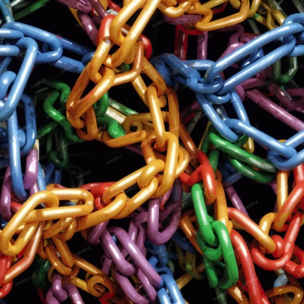A close-up image of an intertwined mass of colorful plastic chains, including orange, yellow, green, blue, purple, and red links. Each chain is visually shiny and appears tangled, creating a chaotic, vibrant pattern against a dark background.