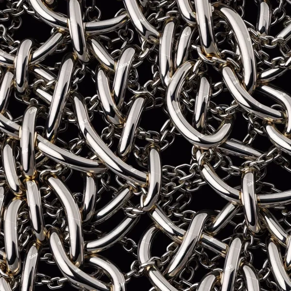 A detailed close-up of numerous interlocking shiny metal chains against a black background, creating a complex and tangled pattern. The chains reflect light, highlighting their polished surface and intricate arrangement.