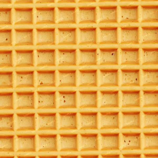 A close-up of Lemons Watercolor 42 (Copy) shows a golden brown waffle surface with a grid of square indentations, crisp edges, and small dark specks.