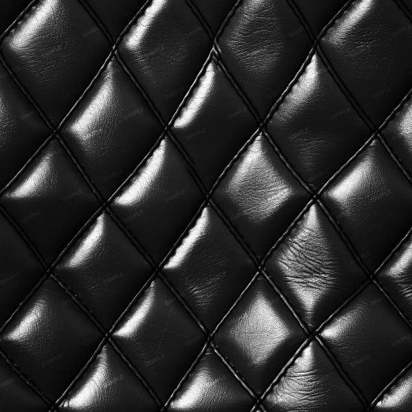 Close-up of Tooled Leather Damask 44, showcasing black quilted leather with a diamond pattern, shiny reflective surfaces, and visible stitching along the seams.