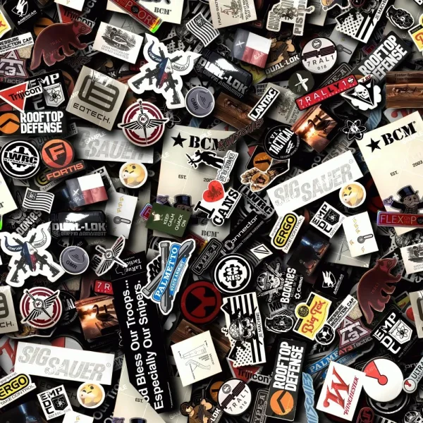 A large assortment of US and Puerto Rico flag stickers in various shapes, sizes, and colors spread across the image, creating a dense and vibrant pattern.