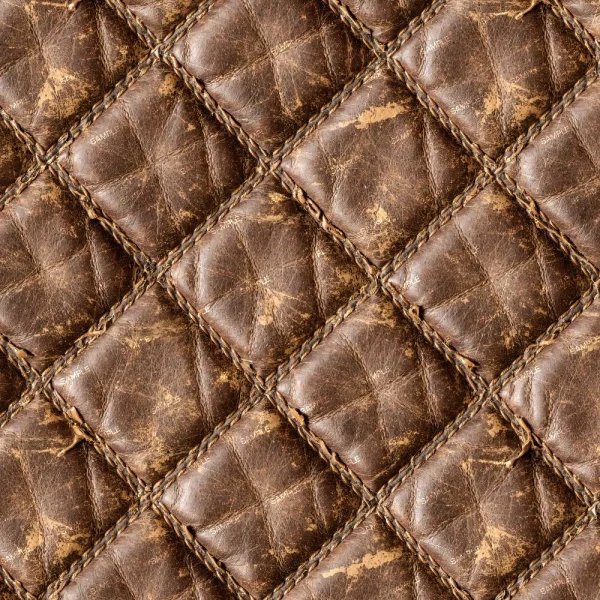 Close-up of Distressed Diamond Stitched Leather 42 (Copy), featuring a quilted surface with visible wear, uneven coloring, and a diamond stitch pattern highlighting its unique texture.
