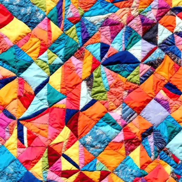A striking quilt crafted from Gothic Black Lace 42 (Copy) fabric, featuring geometric pieces in bright colors sewn together in an abstract patchwork pattern.