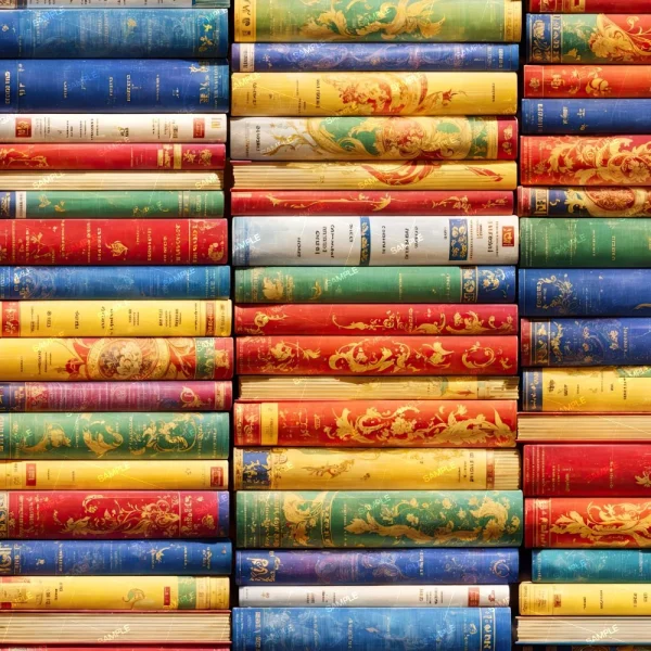 A close-up of rows of books stacked horizontally on Library Shelves 42 (Copy), with spines in ornate red, blue, and yellow designs facing outward.