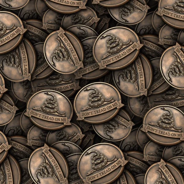 The Don't Tread on Me 32 (Copy) is a bronze-colored coin with a coiled snake and "DON'T TREAD ON ME" in raised text, inspired by the Gadsden flag design.